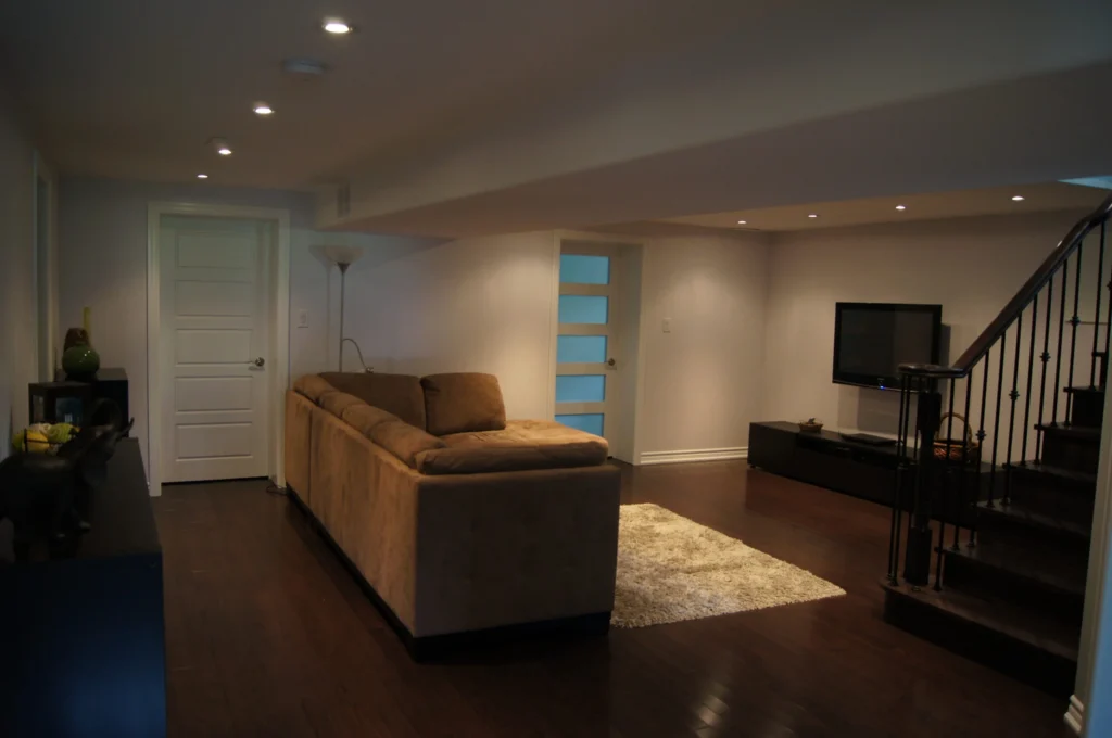 Basement Renovation Services GTA Sleek Finished Basement Frosted Glass Door Dim Potlights