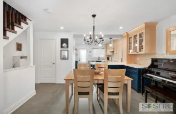 Blue And Light Wood Kitchen With Matching Table And Custom Colour Cabinets