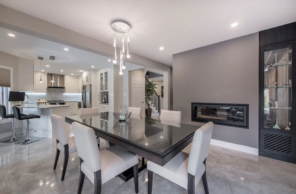 Main Floor Renovation Grey And White Kitchen With Fireplace In Dining Room