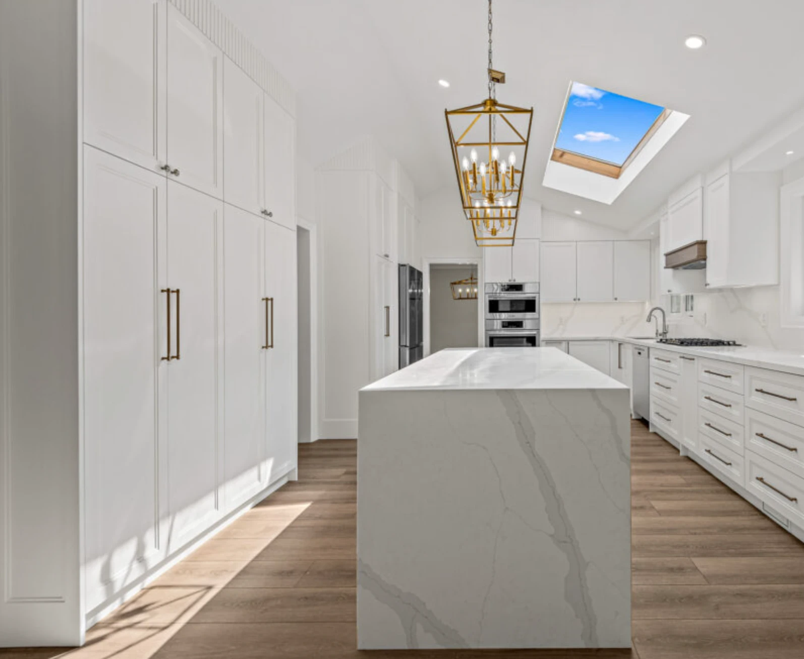 Toronto Main Floor Kitchen Renovation White Custom Shaker Cabinets Skylight