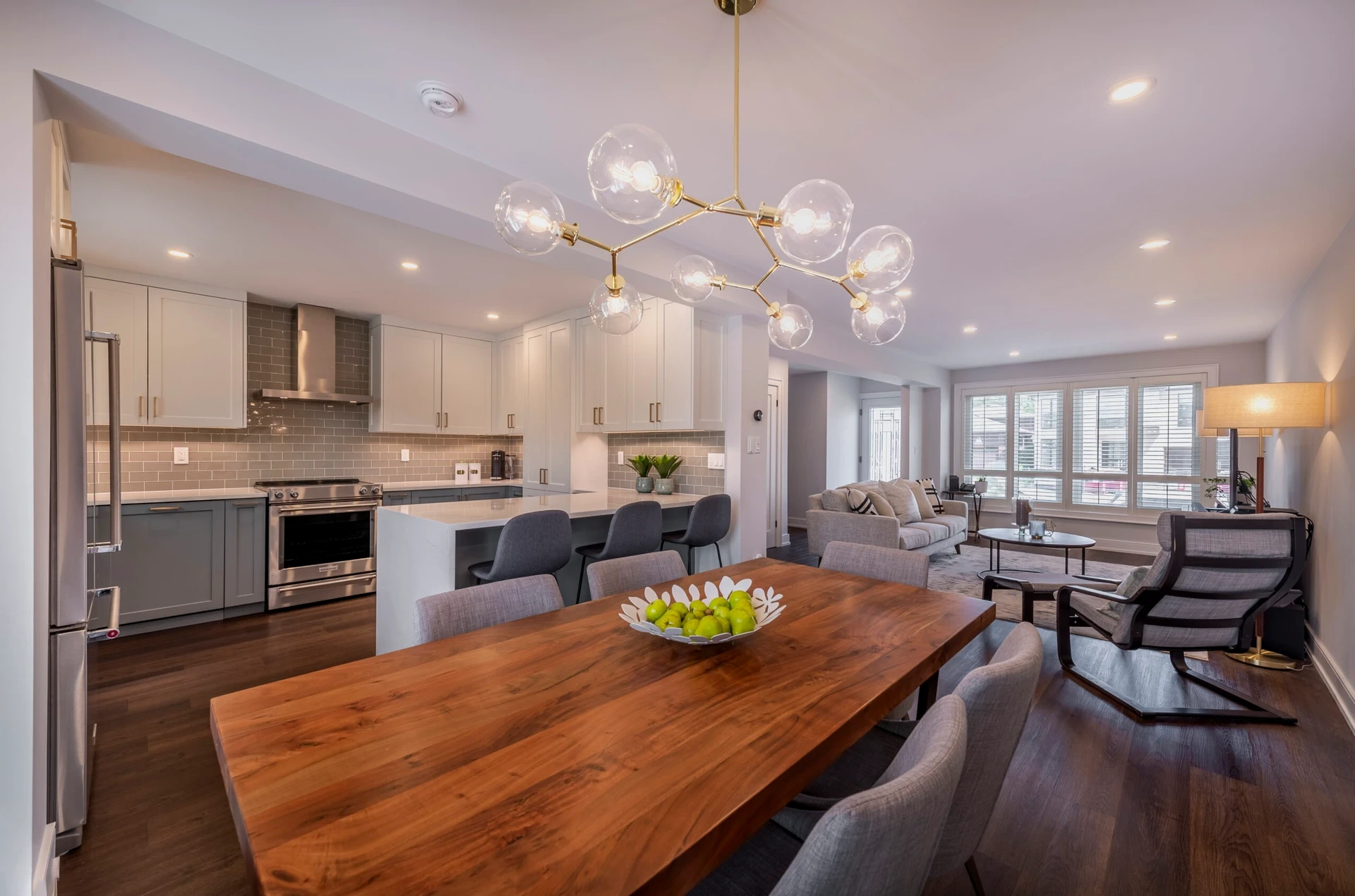 White And Blue Grey Kitchen Cabinets With Gold Accents Free Standing Range Hood Open Concept Renovation