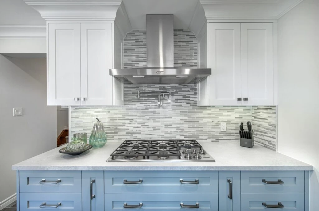 White And Blue Kitchen Renovation With Stone-Like Backsplash Free Standing Hood And Pot Filler