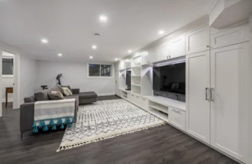 White Custom TV Unit In Basement Renovation Two TV Millwork