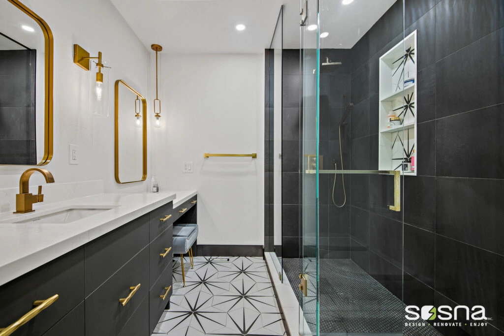 Black And White Bathroom Complimented By Gold Fixtures And Hex Floor Tiles